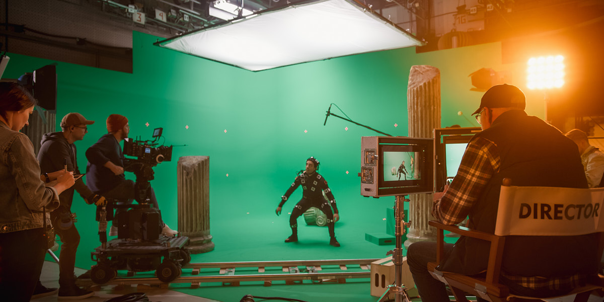 camera crew filming a scene with the producer